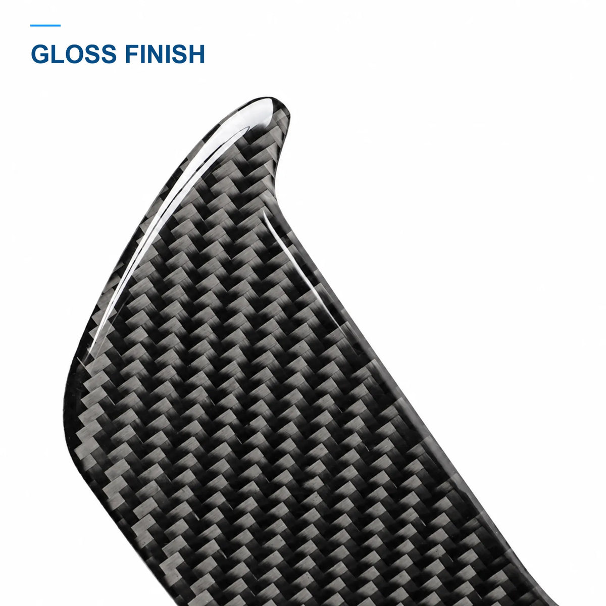 Close-up of the glossy carbon fiber weave and edge of the interior door handle panel cover